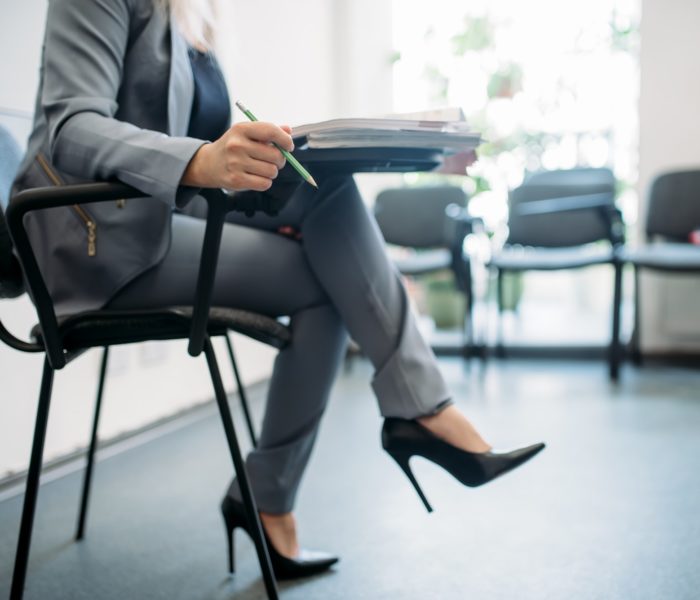 Woman passes interview in office, head hunting